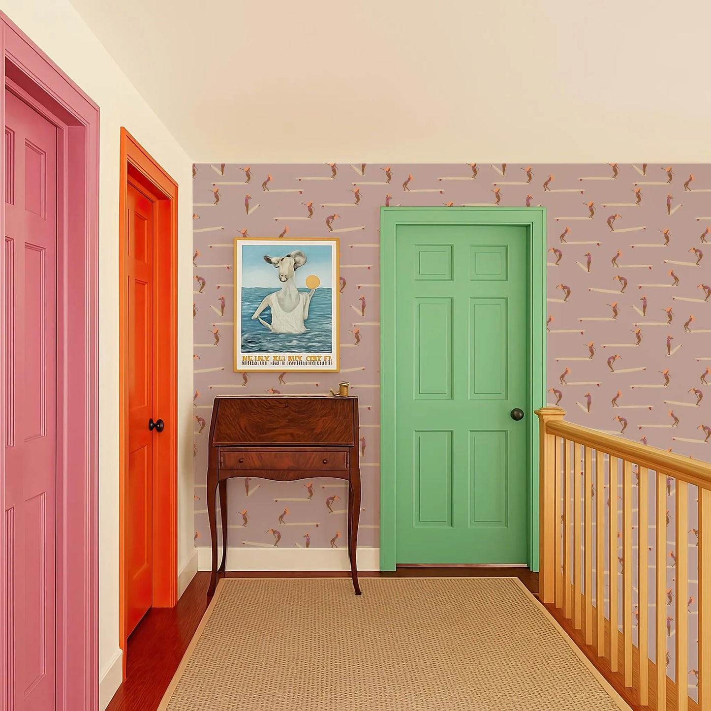 a hallway with a green door, a wooden desk, and a colorful rug. The walls are decorated with a patterned wallpaper, and there is a framed picture hanging on the wall.