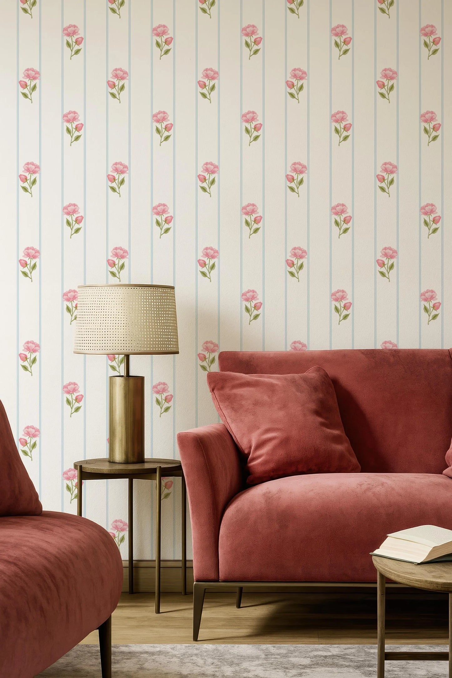 a cozy living room with a red sofa, a wooden coffee table, and a lamp on a side table. The walls are adorned with a floral wallpaper pattern, and the room has a warm and inviting atmosphere.