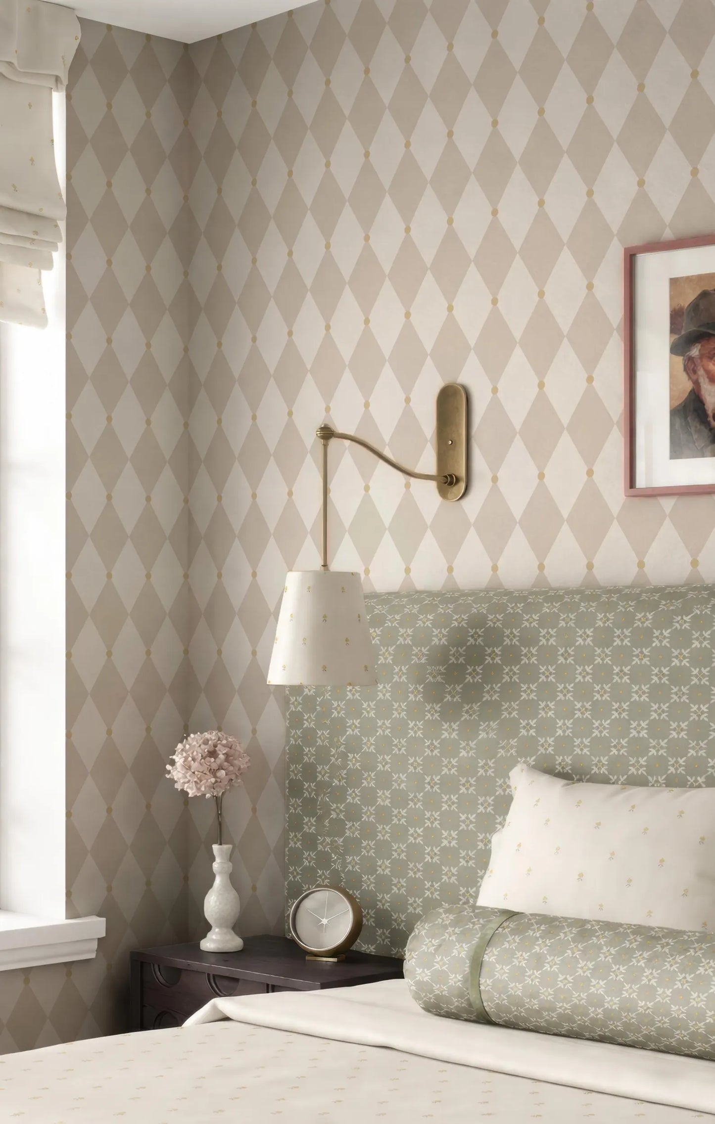a cozy bedroom with a patterned wallpaper, a green and white bedspread, and a framed picture on the wall.