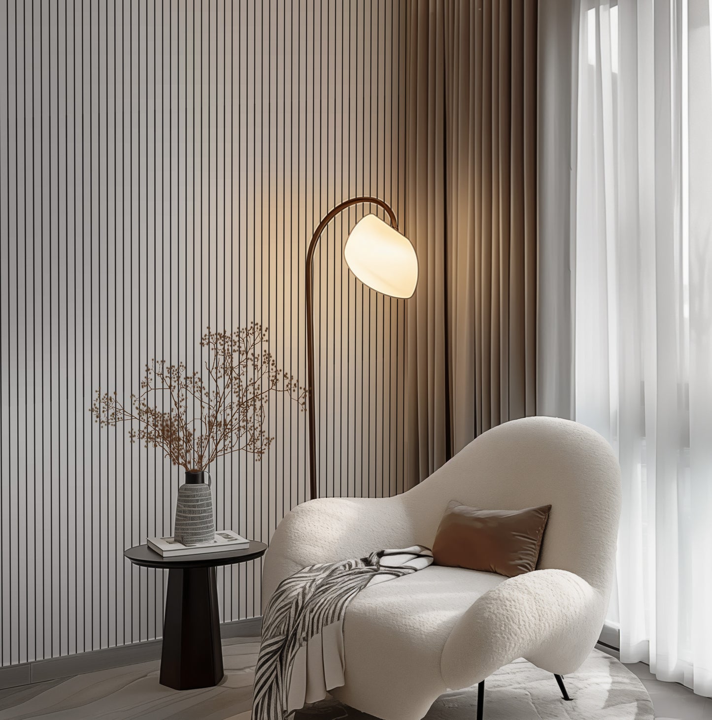 a living room with a chair and a lamp
