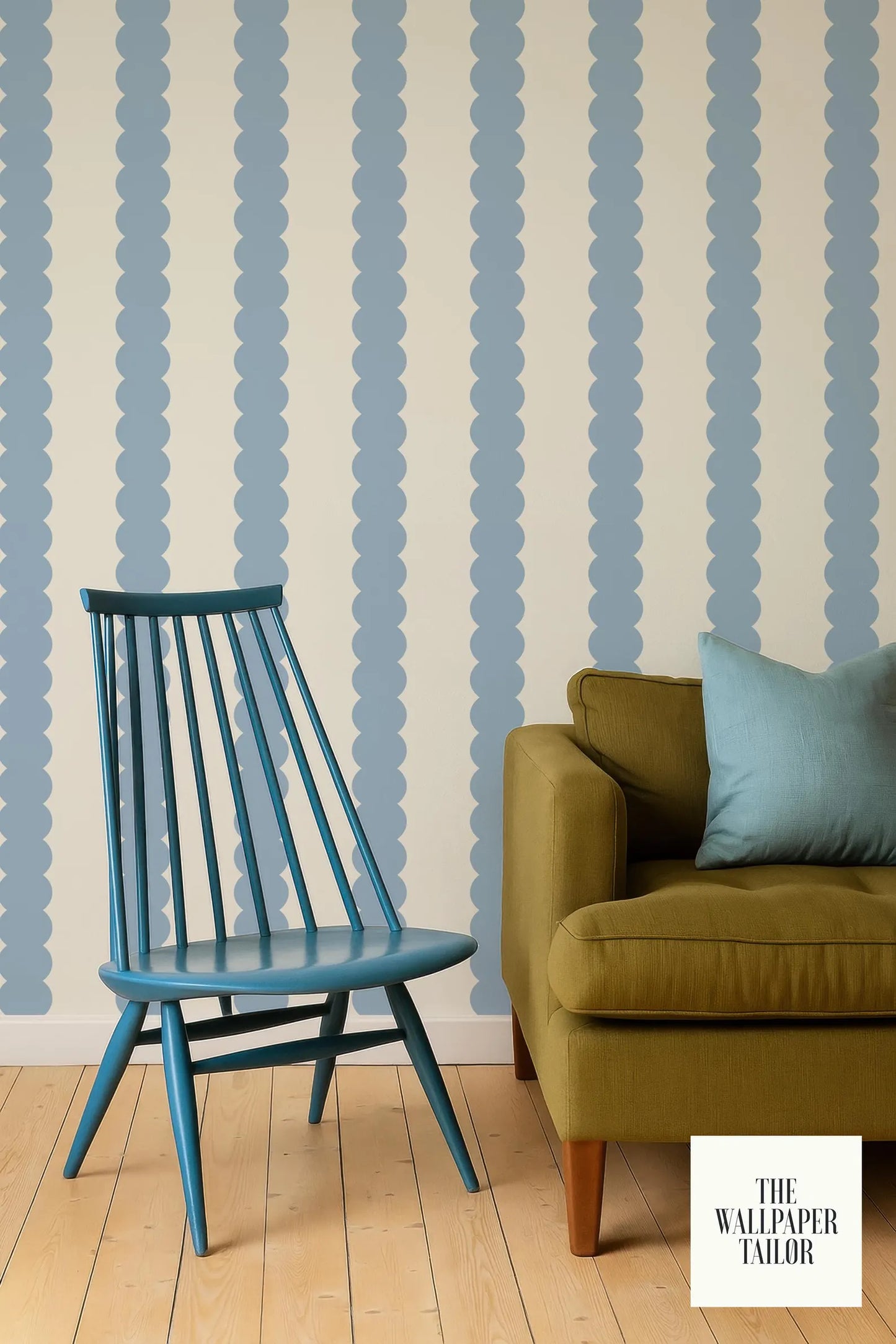 a blue wooden chair and a brown sofa against a striped wallpaper background.