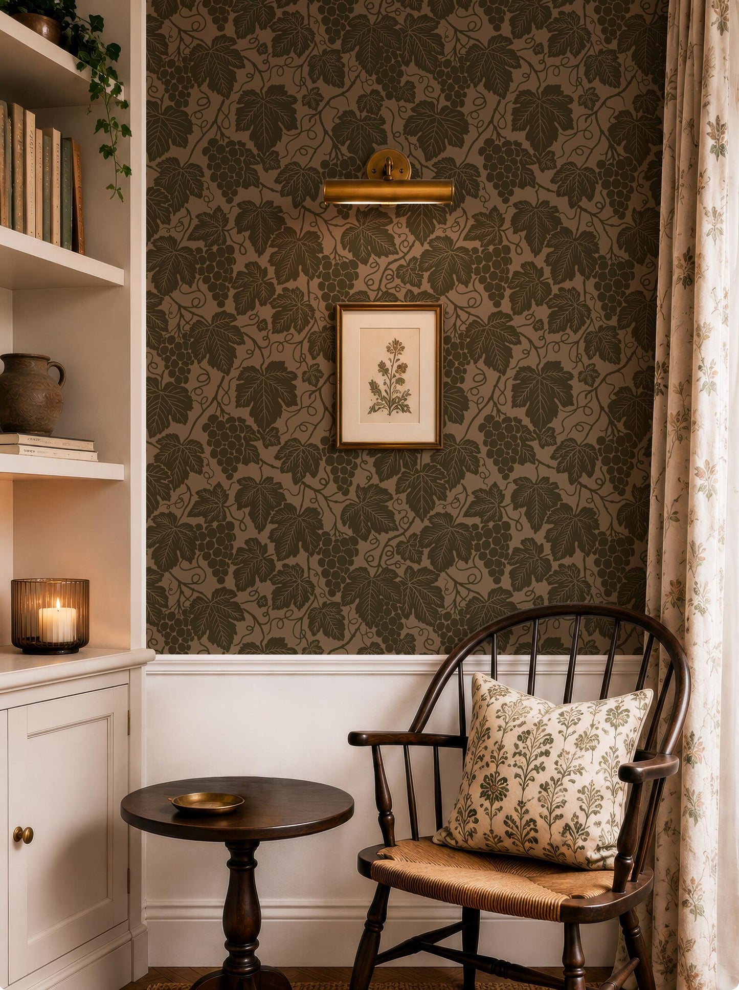 a cozy corner of a room with a dark wood chair, a small round table, and a framed picture of a plant on the wall. The room has a dark green and brown color scheme, with a patterned wallpaper and a shelf with books and a vase.