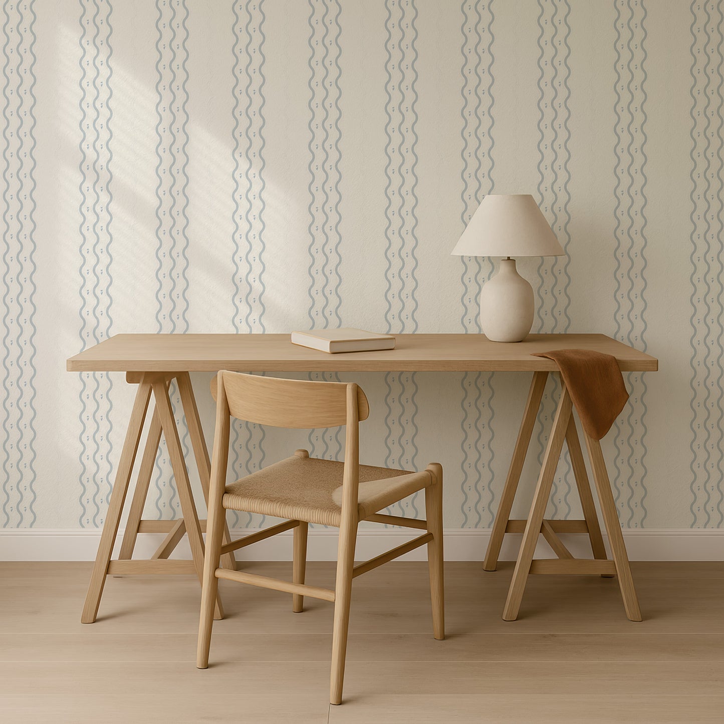 a simple and minimalist workspace with a wooden desk, a wooden chair, and a lamp on a stand.