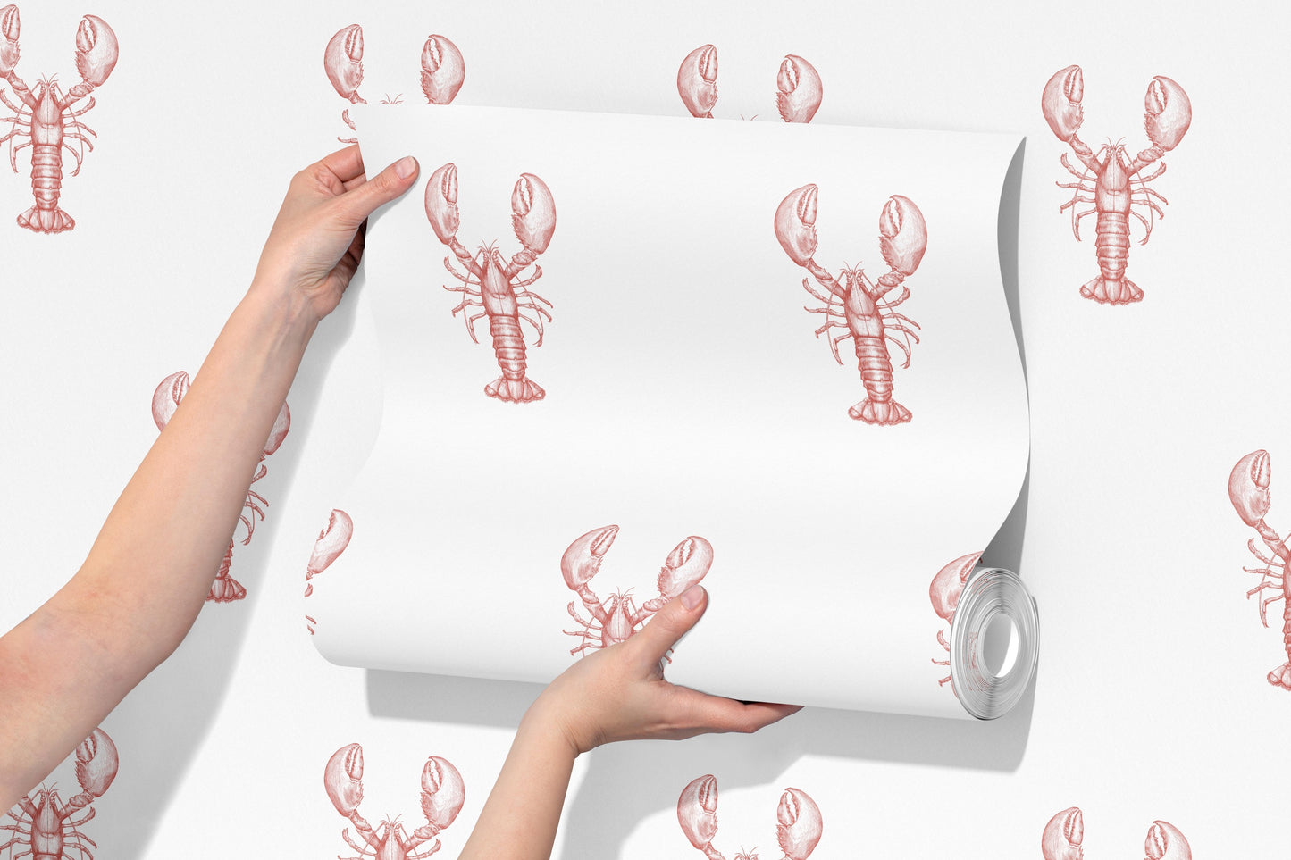 a person holding a roll of paper with lobsters on it