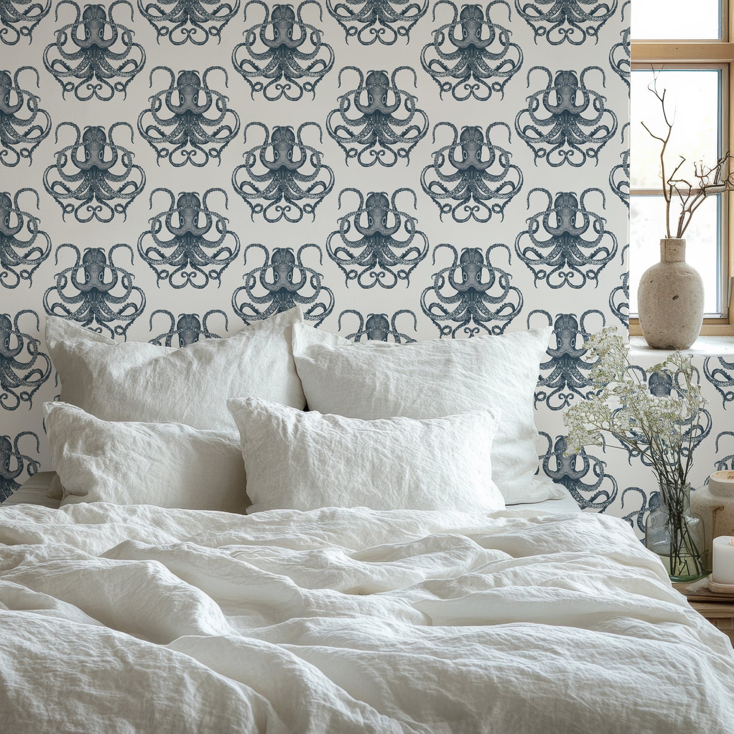 a bed with a white comforter and pillows