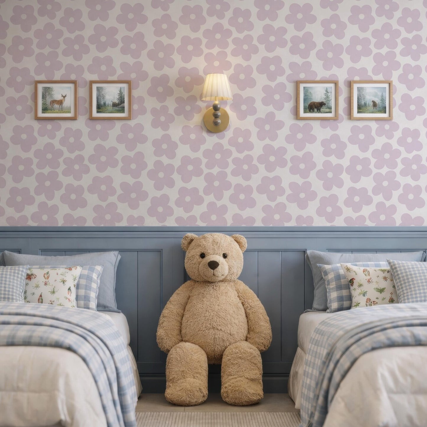 a bedroom with a large teddy bear sitting between two beds. The walls are decorated with a floral pattern, and there are two framed pictures hanging above the beds. The overall color scheme of the room is predominantly blue and white.