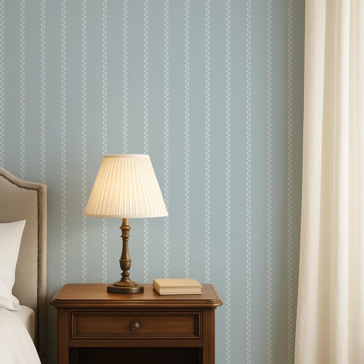 a bedroom scene with a wooden nightstand, a lamp, and a book on the nightstand.