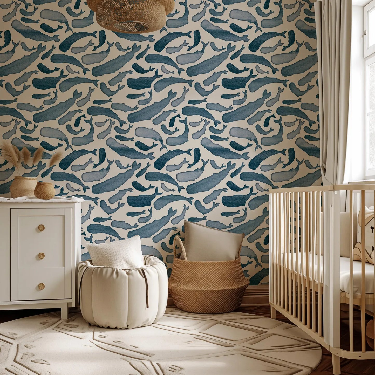a baby's room with a blue and white wallpaper