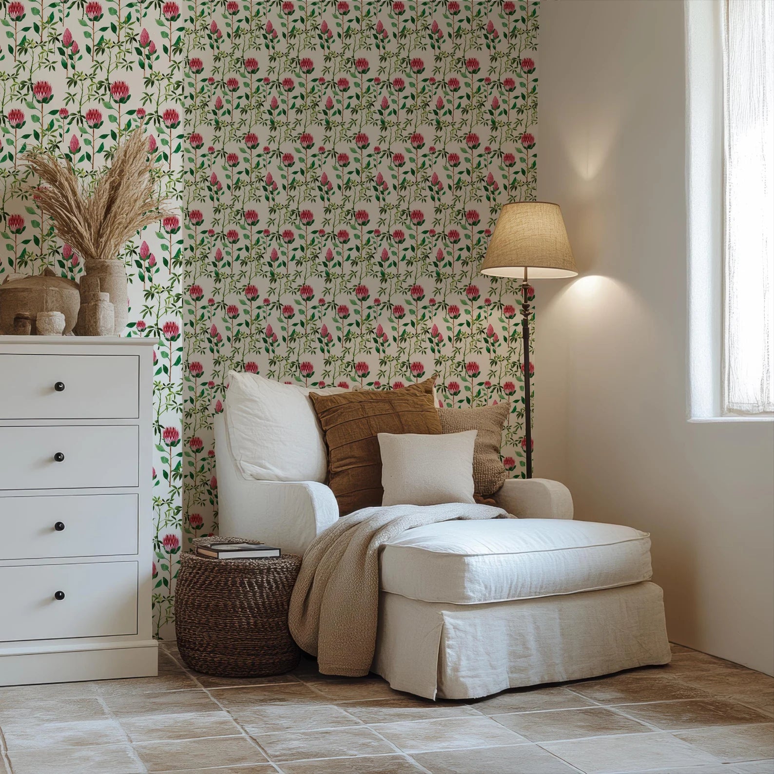 a living room with a white chair and flower wallpaper