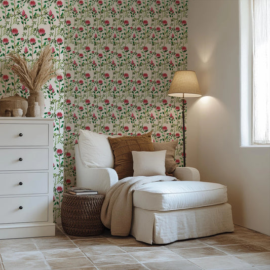 a living room with a white chair and flower wallpaper