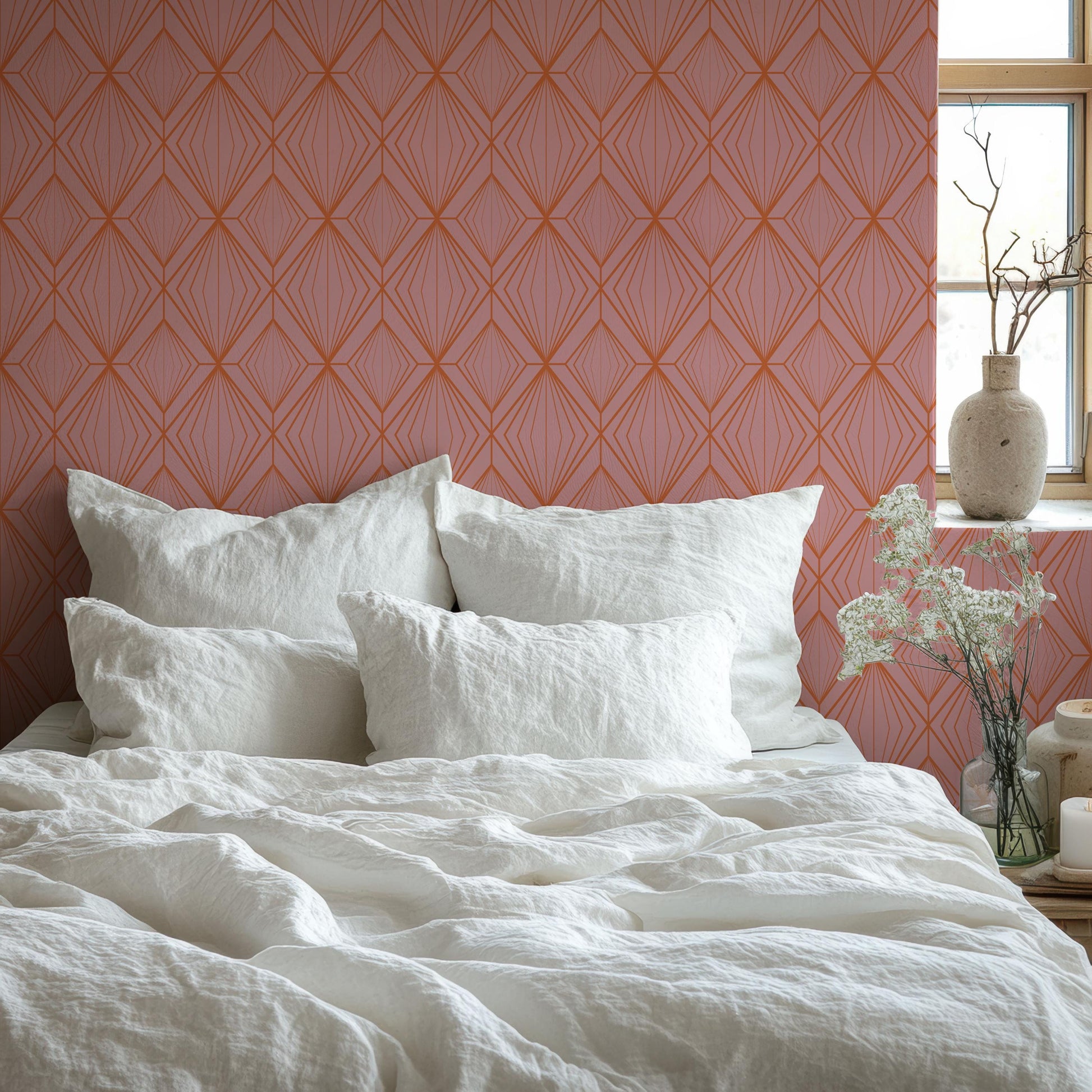 a bed with a white comforter and pillows