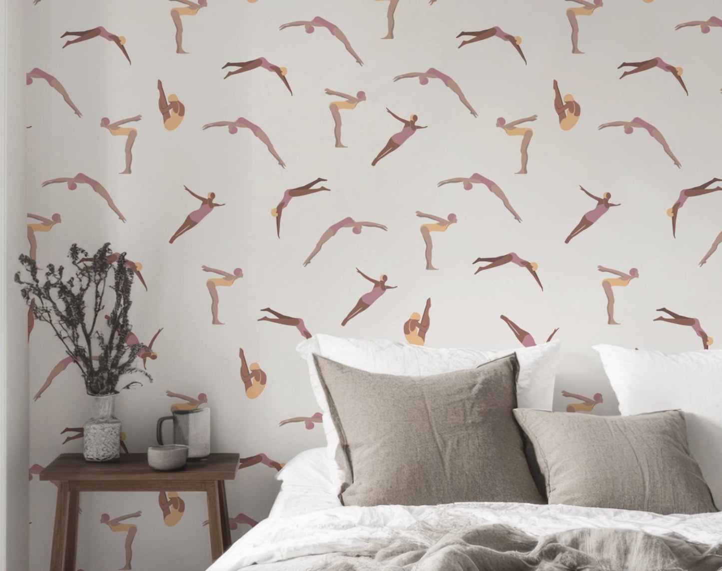 a bed with a white comforter and a wallpaper with a pattern of pink