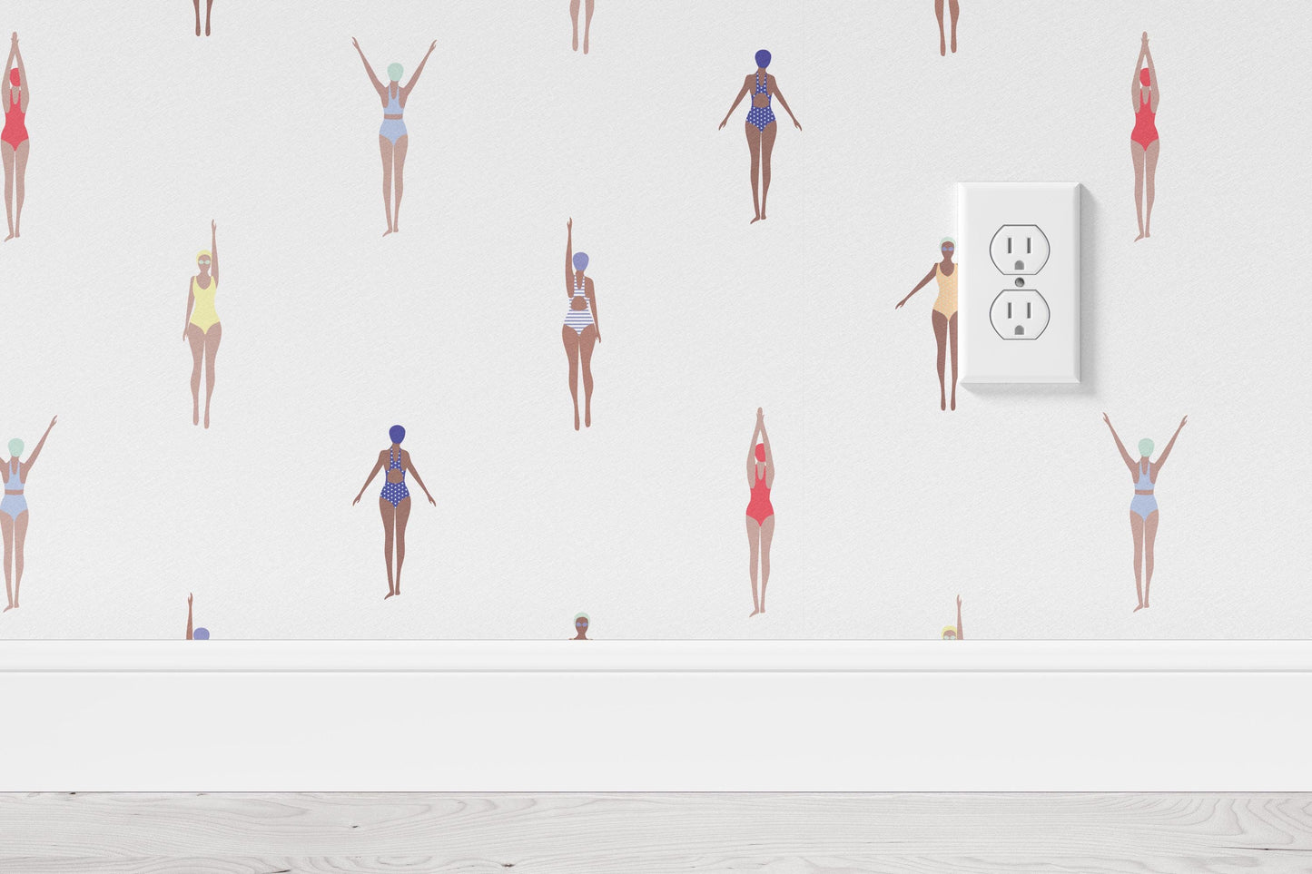 a woman in a bathing suit standing in front of a wall with a light switch