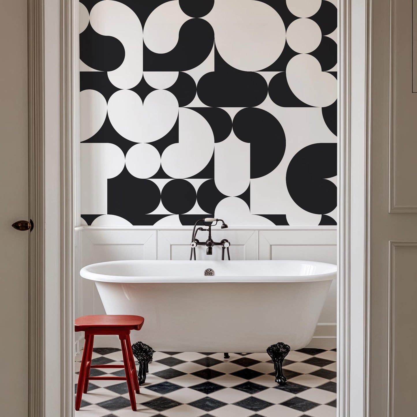 a white bath tub sitting under a black and white wall