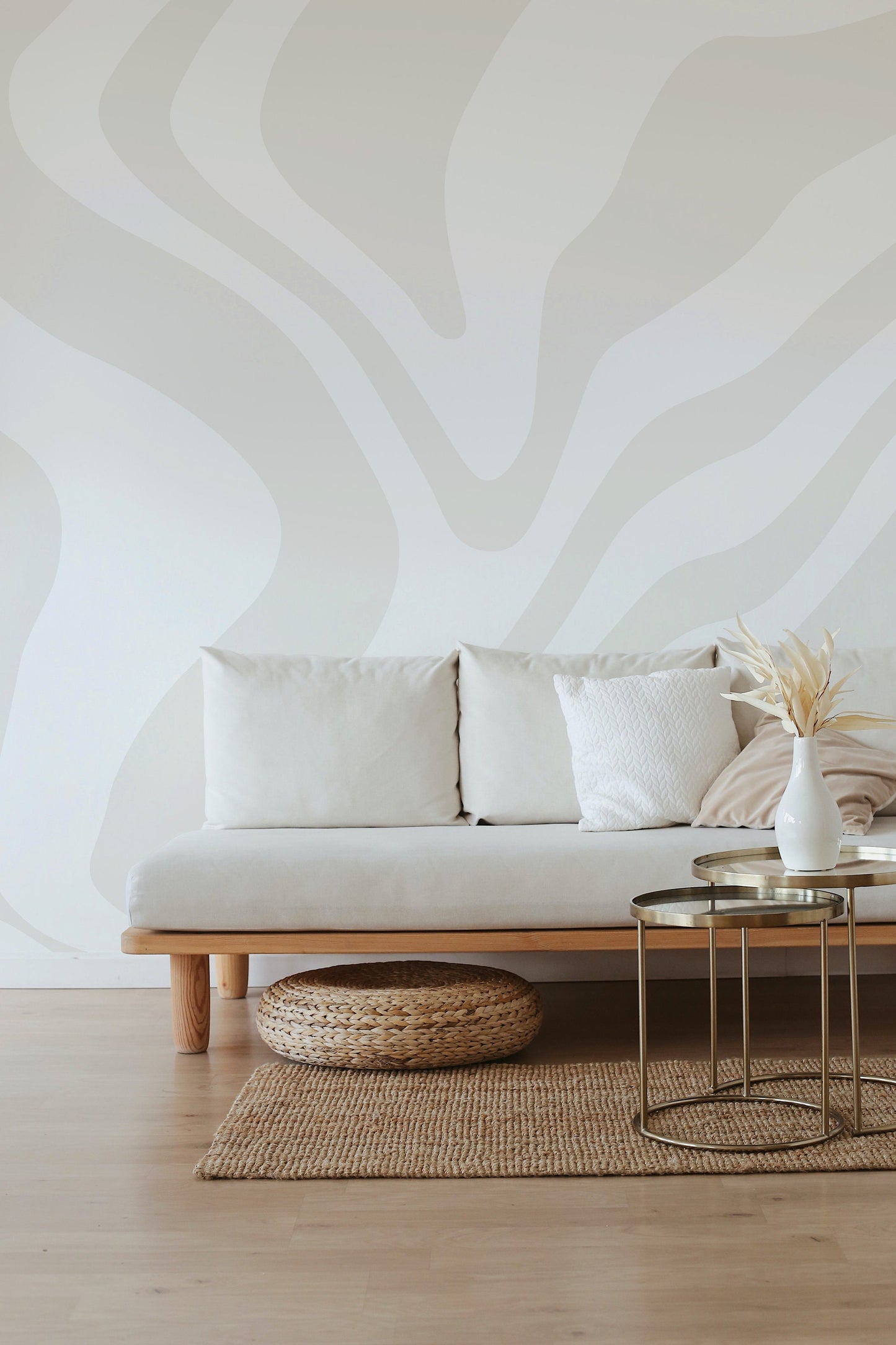 a white couch sitting on top of a wooden floor