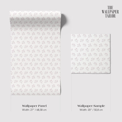 two rolls of wallpaper with a repeating pattern of small flowers or leaves. The rolls are of different sizes, with one being larger than the other.