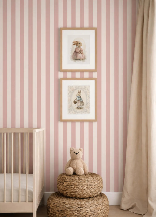 a nursery with pink and white striped wallpaper, a wooden crib, and a beige teddy bear sitting on a woven basket.