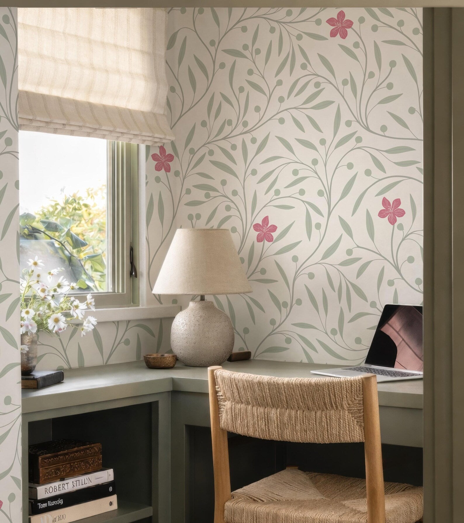 a cozy and well-organized home office space with a desk, a lamp, a laptop, and a window with a view of trees.