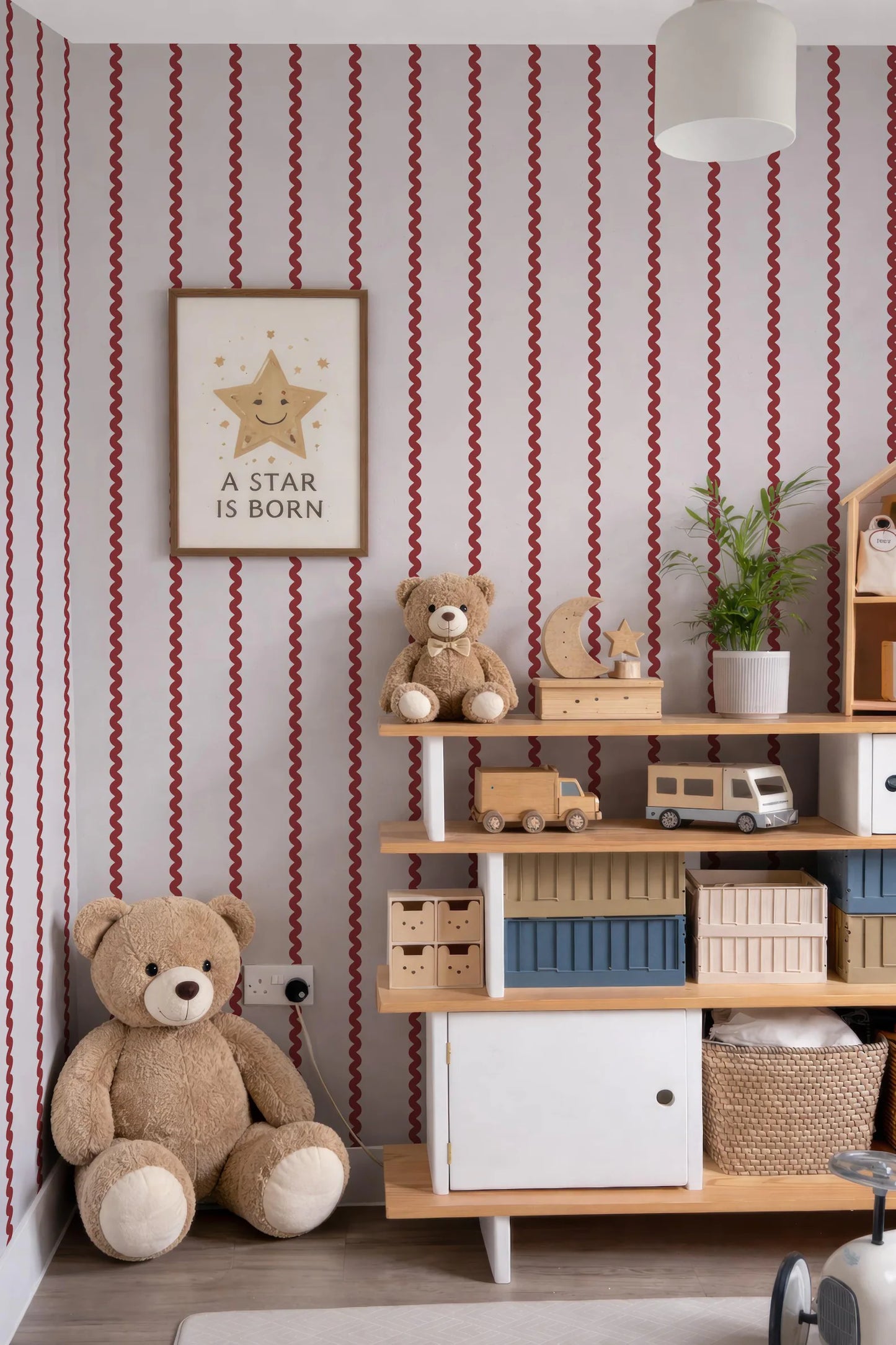a cozy and colorful children's bedroom with a teddy bear, a framed quote, and various toys and storage units.