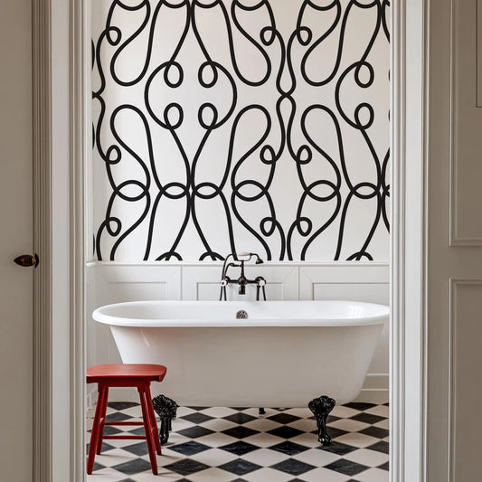 a white bath tub sitting next to a red stool