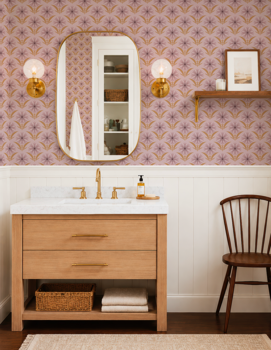 a bathroom with a wooden vanity, a mirror, and a shelf above the vanity. The walls are covered in a patterned wallpaper, and there is a wooden chair next to the vanity.