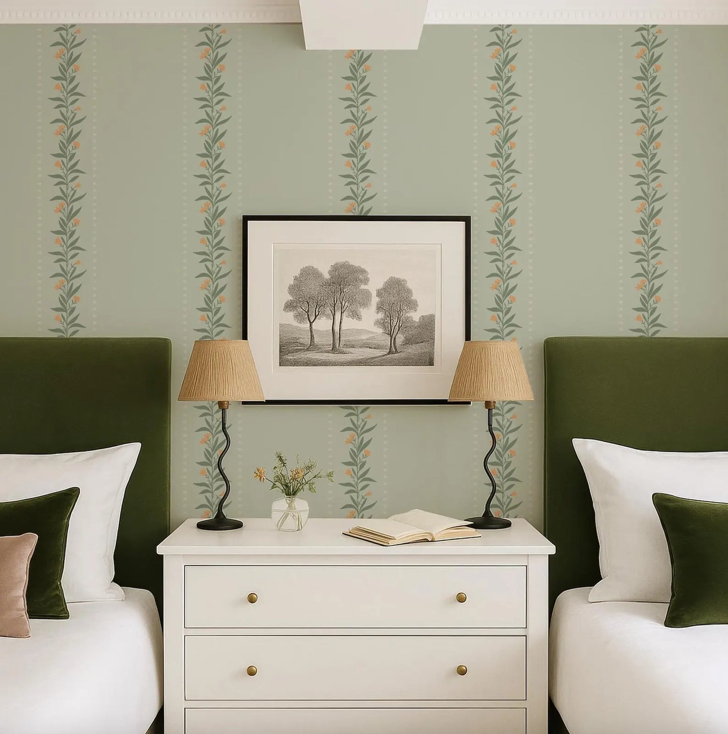 a cozy bedroom with a white dresser, two green headboards, and a framed landscape painting above the dresser. The room has a harmonious color scheme with the green walls and white furniture.