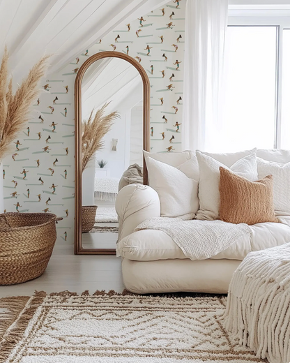 a cozy living room with a large mirror, a white sofa with throw pillows, and a woven basket. The room has a bohemian and eclectic decor style, with a mix of natural and textured elements.