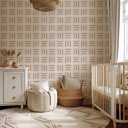 a cozy nursery with a crib, a white dresser, and a woven basket. The walls are covered in a patterned wallpaper, and the room has a warm, neutral color scheme.