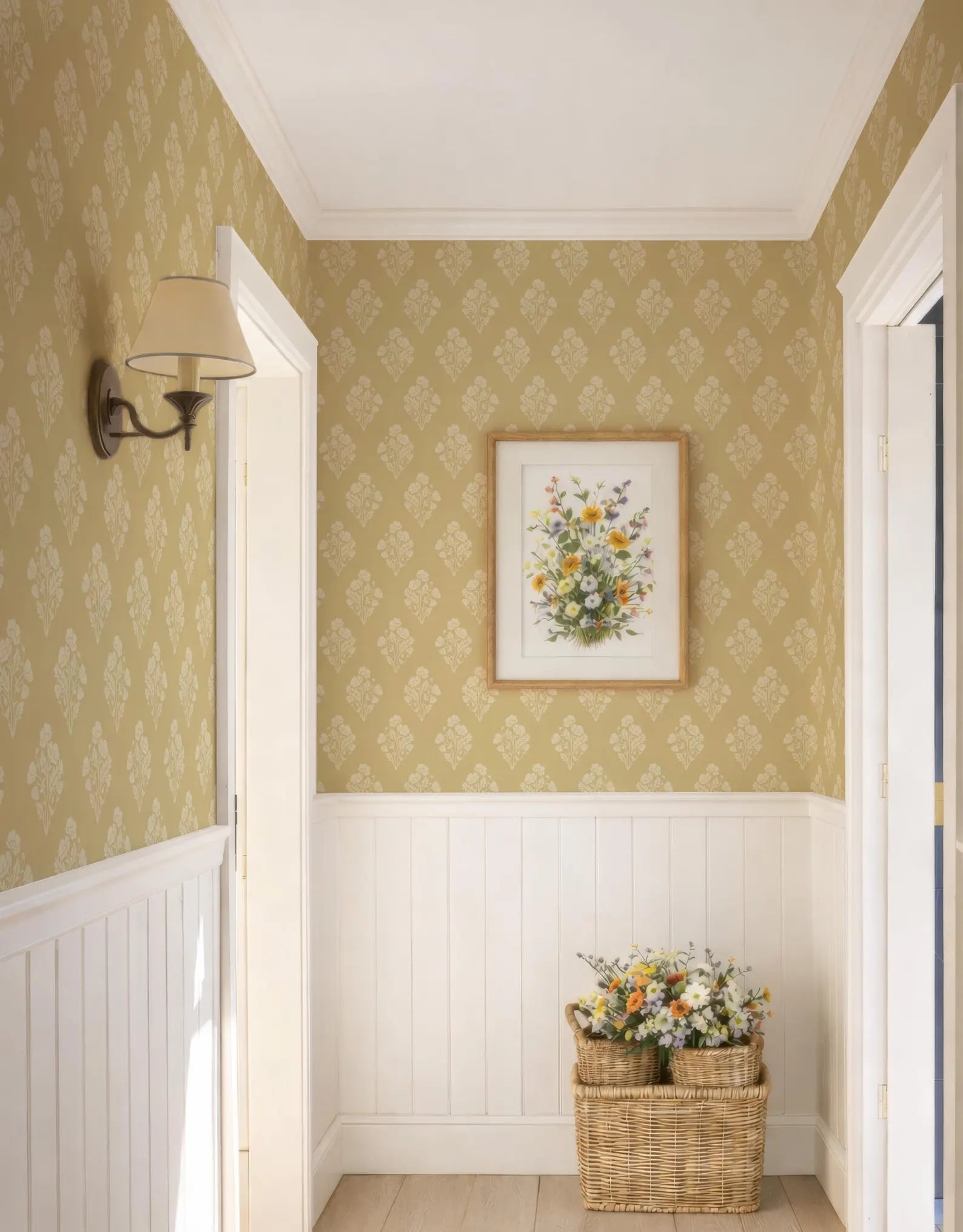 a hallway with a wicker basket filled with flowers placed in the corner, and a framed floral artwork hanging on the wall above it.