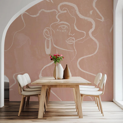 a dining room with a wooden table and four white chairs. The table is set with a vase of flowers and two vases, creating a pleasant and inviting atmosphere. The walls of the dining room are adorned with a large mural depicting a woman's face, adding an artistic touch to the space.