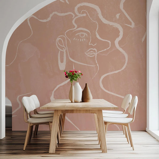 a dining room with a wooden table and four white chairs. The table is set with a vase of flowers and two vases, creating a pleasant and inviting atmosphere. The walls of the dining room are adorned with a large mural depicting a woman's face, adding an artistic touch to the space.