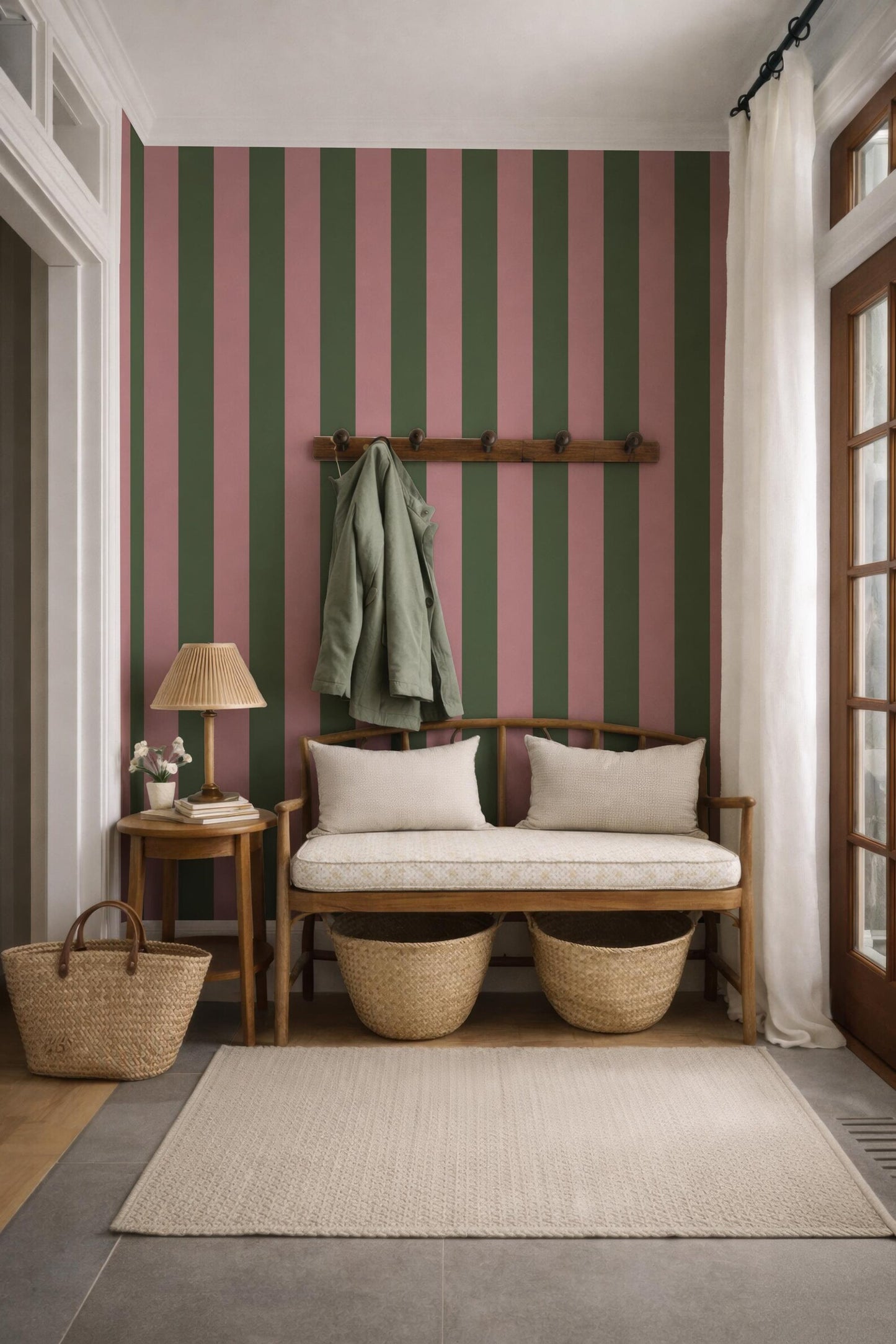 a cozy entryway with a bench, a coat rack, and a woven basket. The walls are striped in pink and green, and there is a rug on the floor.