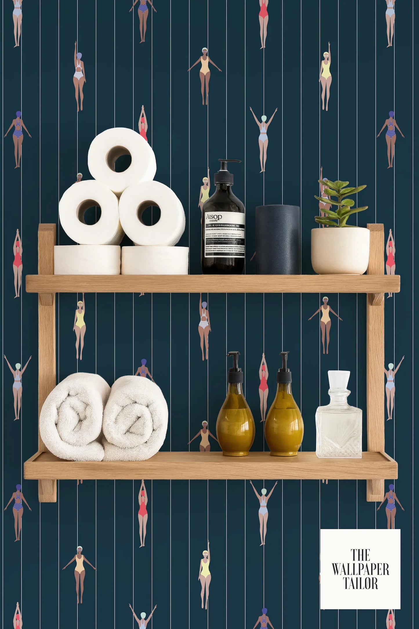 a bathroom shelf with various toiletries and towels, including a bottle of soap, a bottle of lotion, and a bottle of shampoo. The shelf is set against a dark blue background with a pattern of swimming figures.