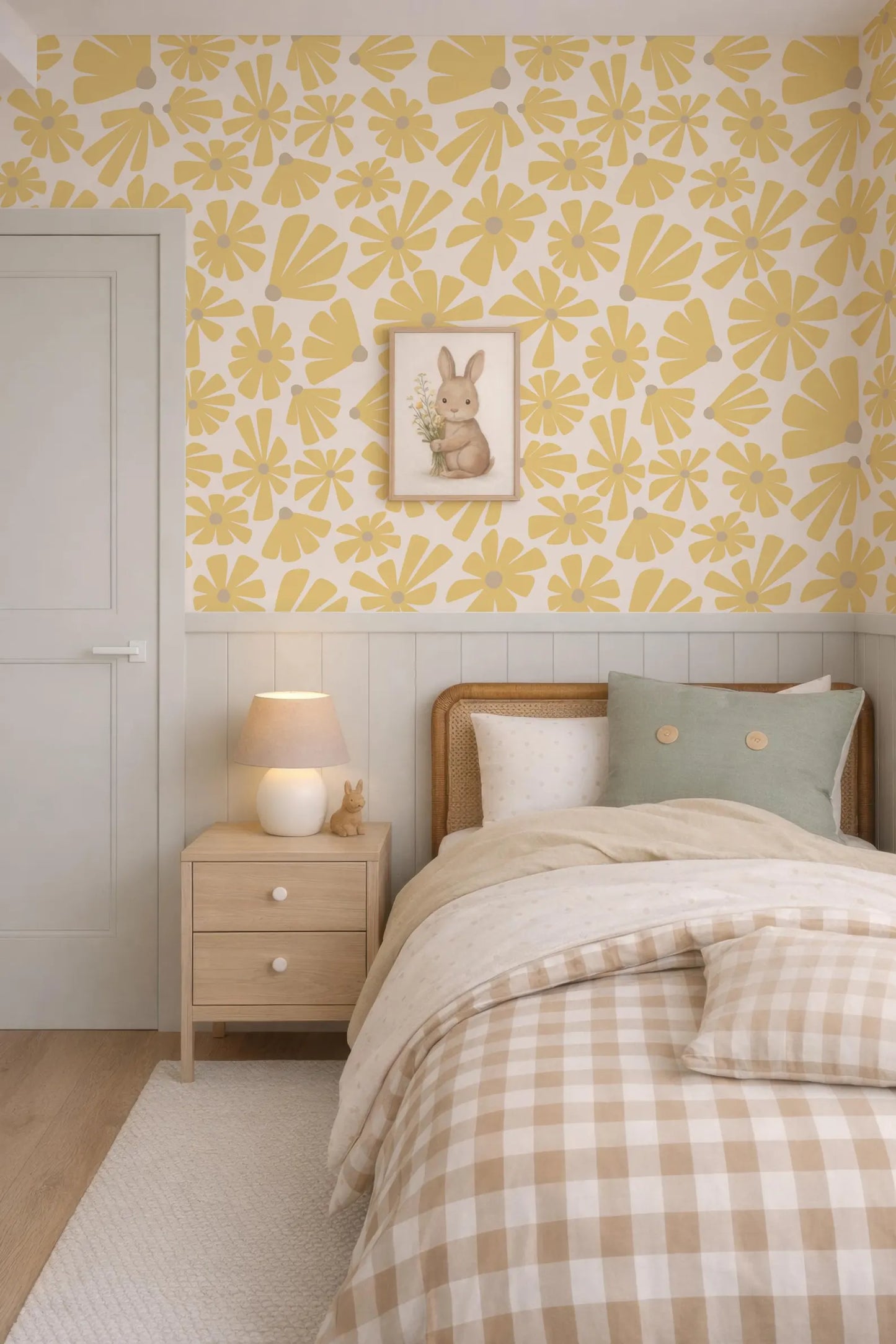 a cozy bedroom with a bed, nightstand, and a framed picture of a bunny on the wall. The room has a yellow and white floral wallpaper, and the bed is covered with a checkered comforter and pillows.