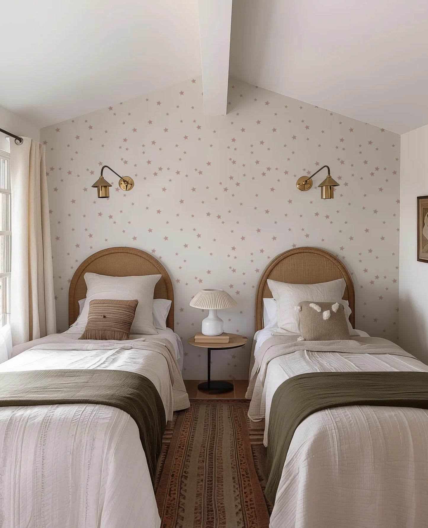 a cozy bedroom with two twin beds, each with a wooden headboard and white bedding. The walls are adorned with a star-patterned wallpaper, and the room features two wall sconces and a small side table with a lamp.