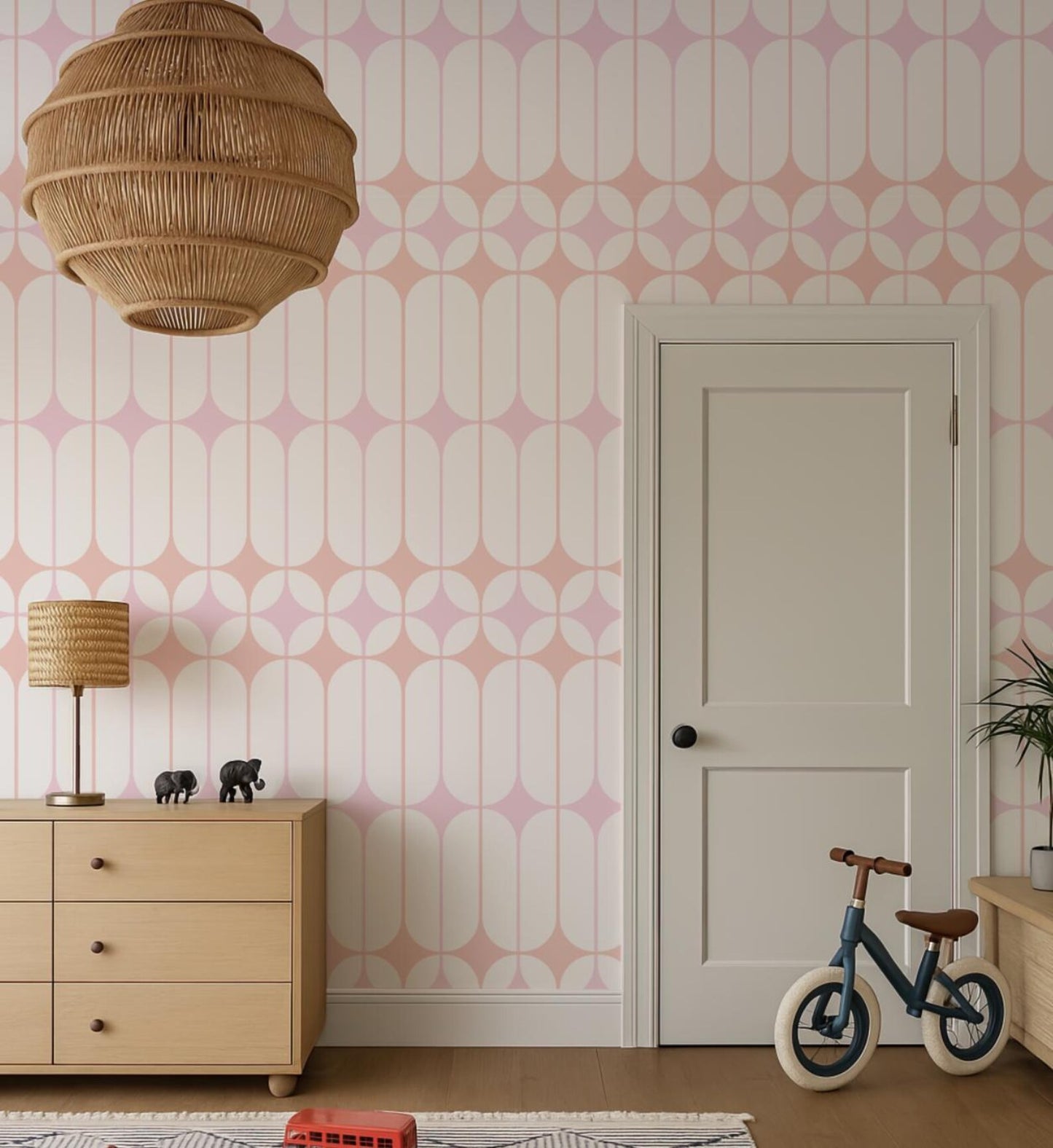 a room with a white door, a wooden dresser, a hanging lamp, and a small blue bicycle.