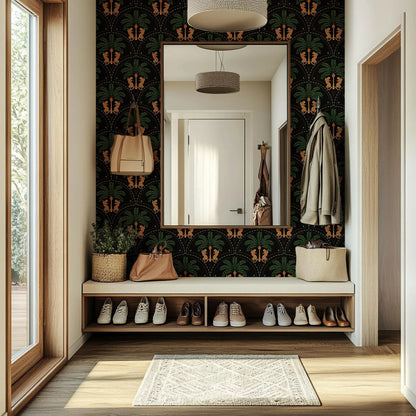 a well-organized entryway with a large mirror, a shelf with shoes, and a decorative wall with a tropical pattern.