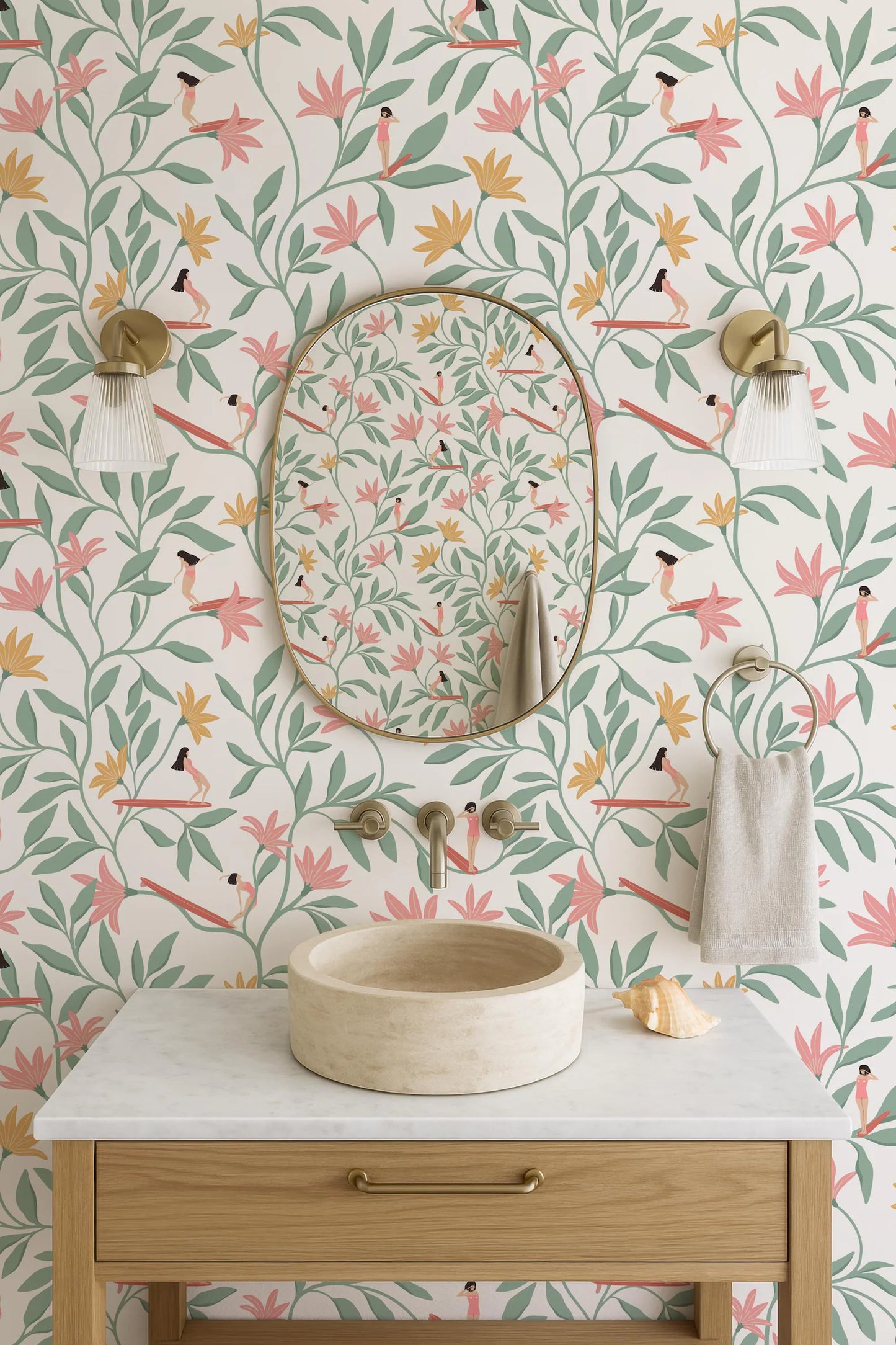 a bathroom with a white sink, a round mirror, and a wooden vanity. The walls are decorated with a floral pattern in shades of pink, green, and yellow.
