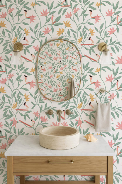 a bathroom with a white sink, a round mirror, and a wooden vanity. The walls are decorated with a floral pattern in shades of pink, green, and yellow.