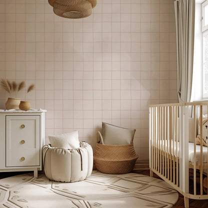 a cozy nursery room with a crib, a white dresser, and a woven basket. The room has a pink and white color scheme, and the furniture appears to be made of natural materials, such as wood and woven fabric.