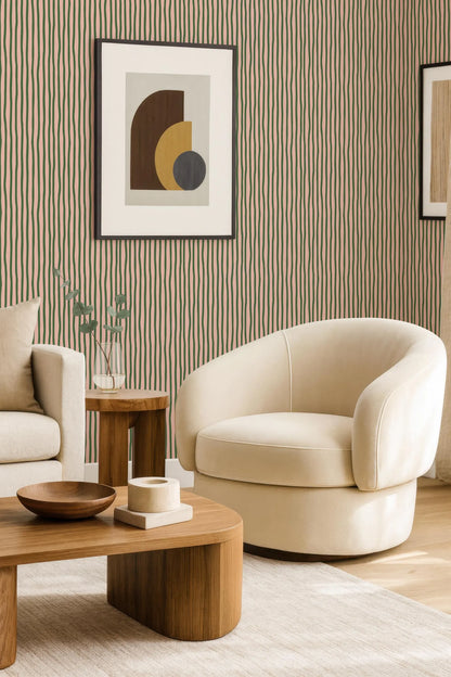 a modern living room with a white armchair, a wooden coffee table, and a framed abstract artwork on the wall.