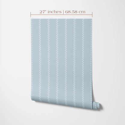 A light blue wallpaper with a repeating pattern of vertical lines, measuring 27 inches by 68.58 cm.