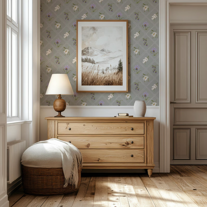 a cozy and well-decorated living room with a wooden dresser, a lamp, and a framed landscape painting on the wall.