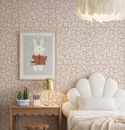 a cozy and charming bedroom with a white bed, a wooden nightstand, a lamp, and a framed picture of a rabbit. The walls are covered in a floral wallpaper, and the room has a warm and inviting atmosphere.