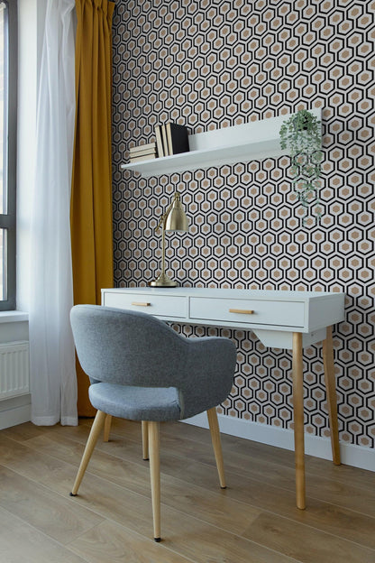a modern and stylish workspace with a white desk, a gray armchair, and a patterned wall behind the desk.