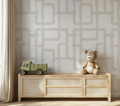 a wooden cabinet with a toy truck on top, and a stuffed teddy bear sitting on the cabinet.