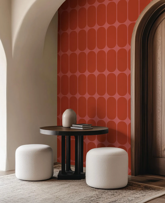 a living room with a table and two stools