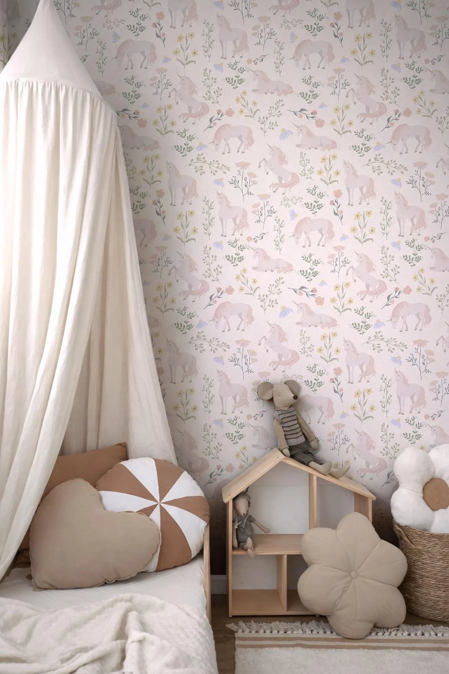 a cozy and charming bedroom scene, featuring a canopy bed with a white canopy, a wooden dollhouse, and various decorative pillows and stuffed animals.