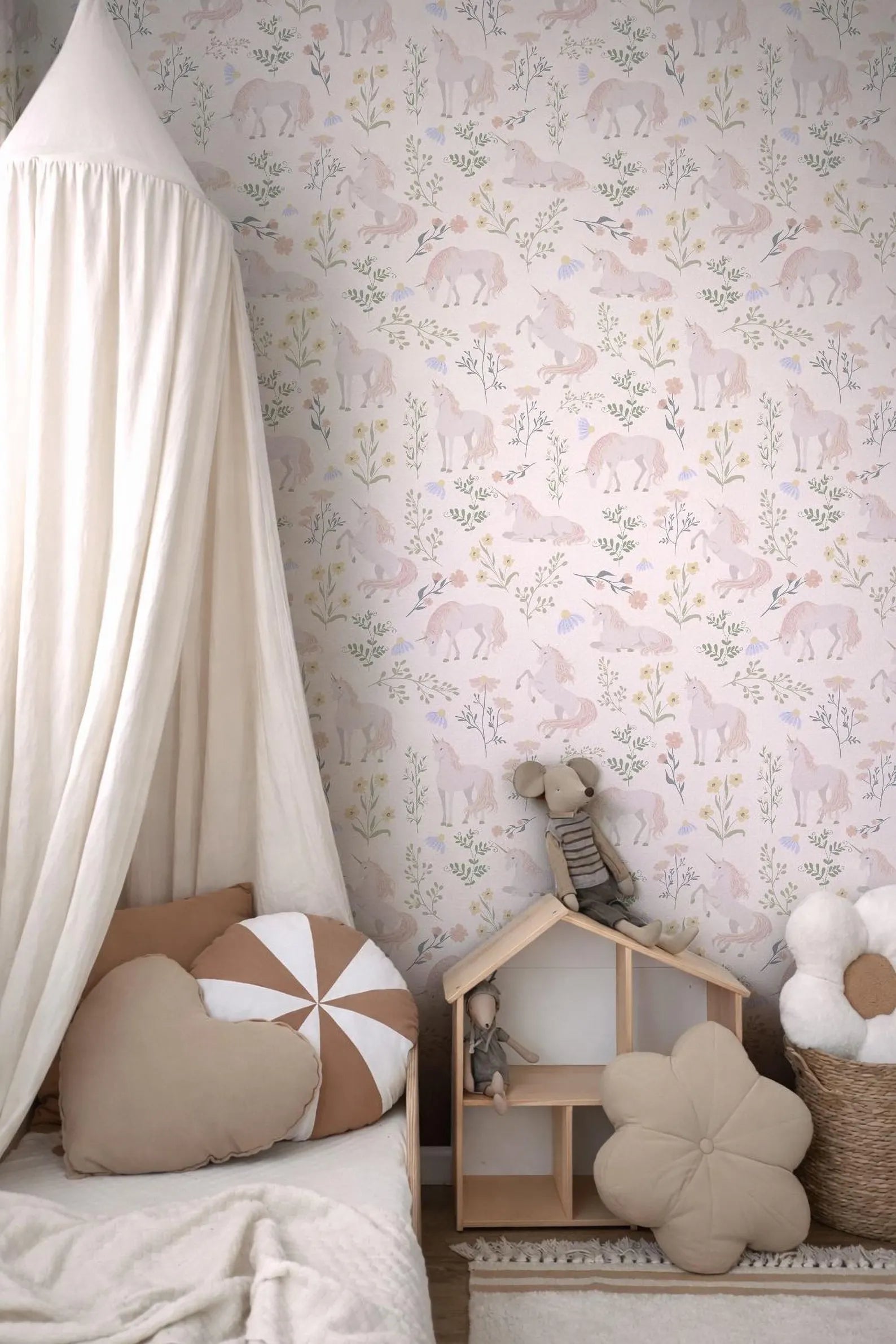a cozy and charming bedroom scene, featuring a canopy bed with a white canopy, a wooden dollhouse, and various decorative pillows and stuffed animals.