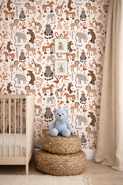 A nursery room with a wooden crib, a stack of woven baskets, and a blue teddy bear. The walls are covered in a patterned wallpaper featuring various animals and wildlife.